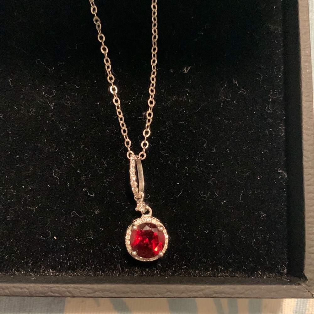 Garnent and diamond chipped pendant with silver chain